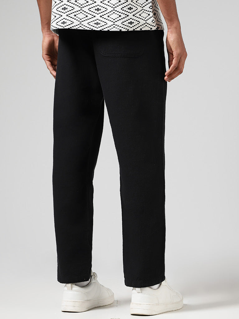 Westside ETA Men's Self Black Cotton Relaxed-Fit Low-Rise Chinos for Casual Wear Back View