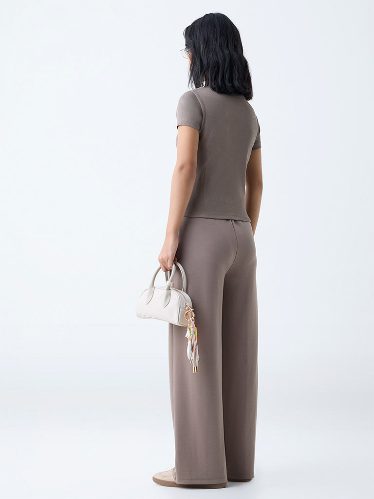 Westside Studiofit Women's Brown Solid High-Rise Track Pants for Sports Wear Back View