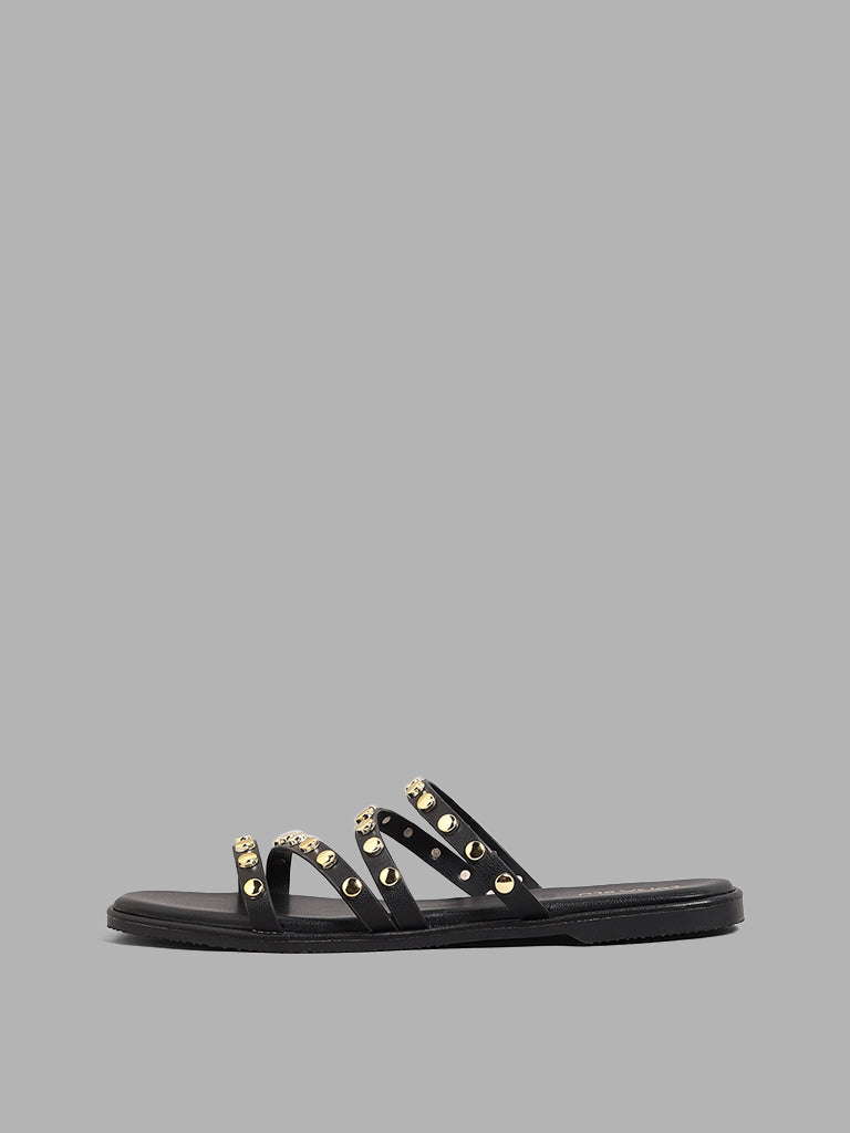 Black slides with online gold studs