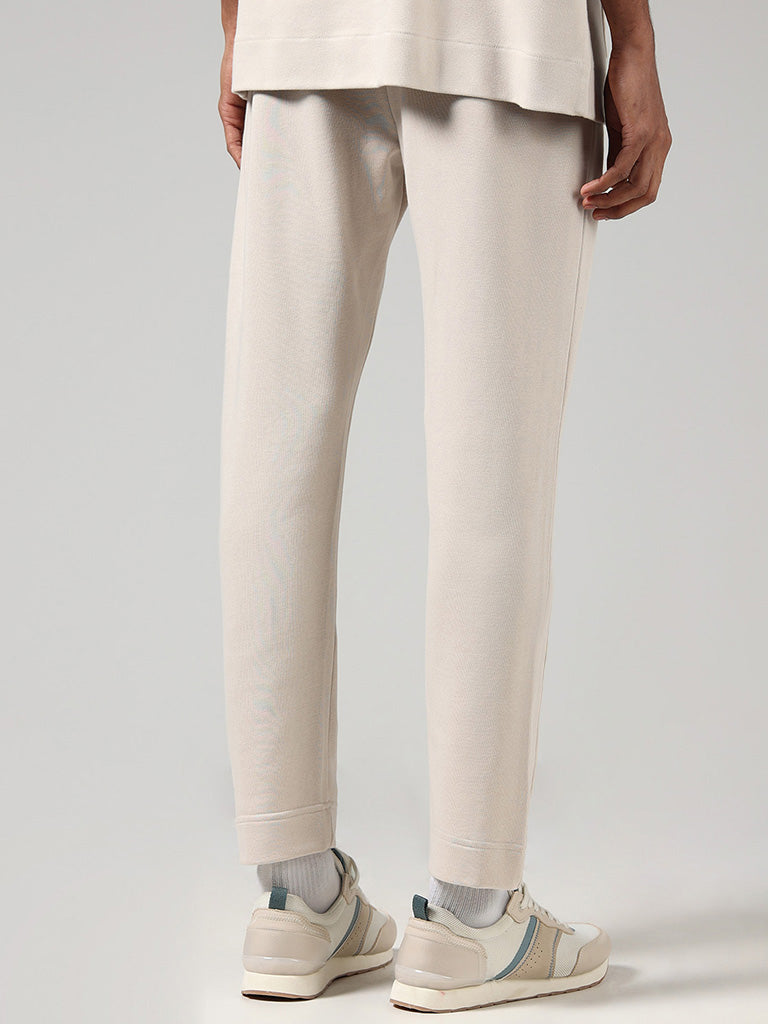 Buy Studiofit Solid Cream Relaxed Fit Track Pants from Westside