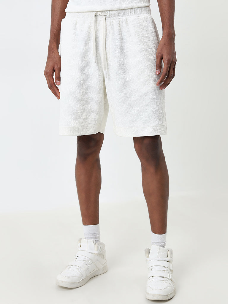 Buy Studiofit White Textured Relaxed Fit Mid Rise Shorts from Westside