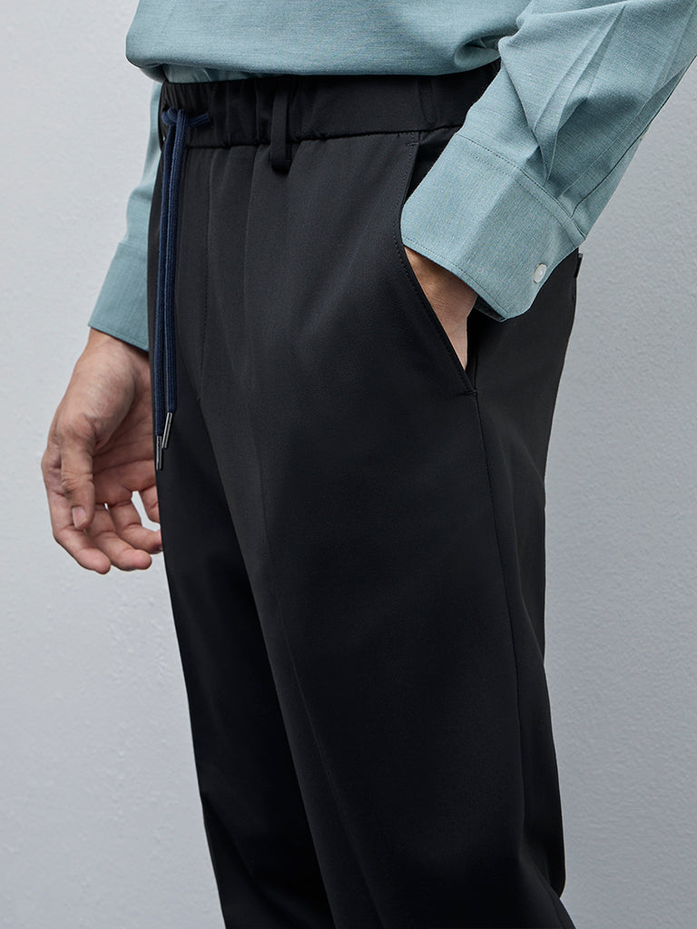 WES Formals Black Solid Carrot-Fit Mid-Rise Trousers