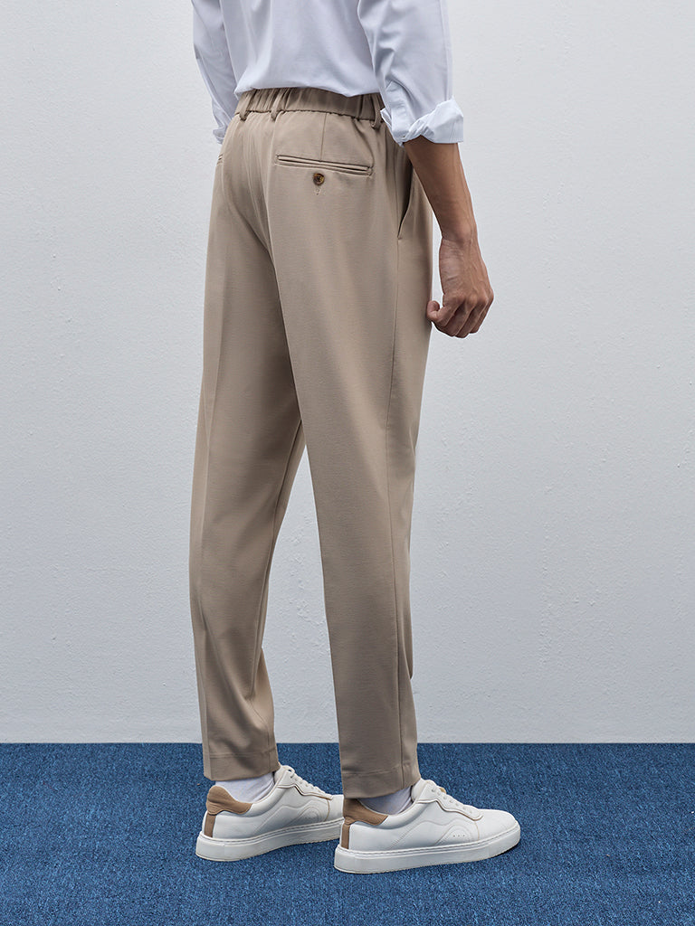 WES Formals Beige Solid Carrot-Fit Mid-Rise Trousers