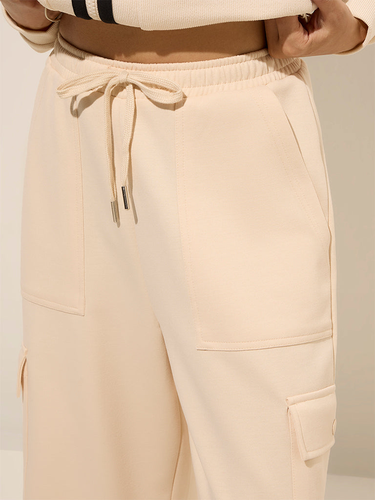 Studiofit Beige Solid High-Rise Cargo Track Pants