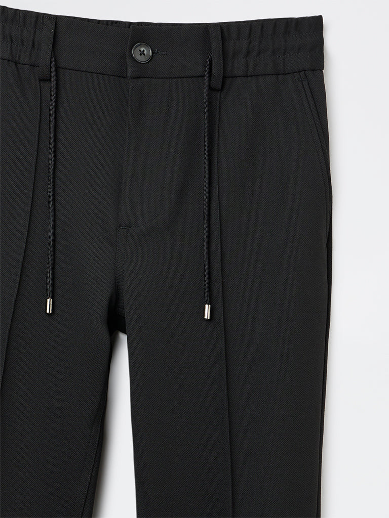 Studiofit Black Solid Relaxed-Fit Mid-Rise Pants