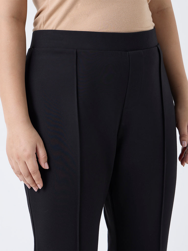 Diza Black Solid Flared Pants